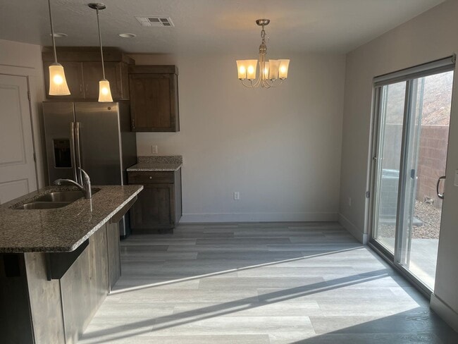 Building Photo - 3 bed | 2.5 bath | 2-car Townhome with Was...