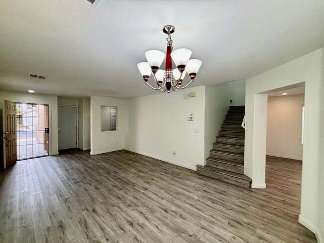 Building Photo - Welcome to this charming 4 bedroom, 2.5 bathroom home.