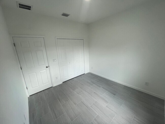 Building Photo - Brand-New 4BR/2BA Luxury Home with 2-Car Garage – Desirable 33971 Location