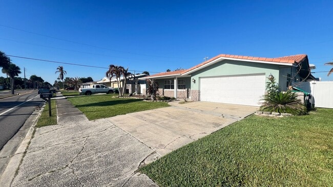 Building Photo - IMMACULATE 4 Bedroom, 2 Bathroom Home in Cocoa Beach!! ONLY MINUTES from the Beach!! (Lawn Care I...