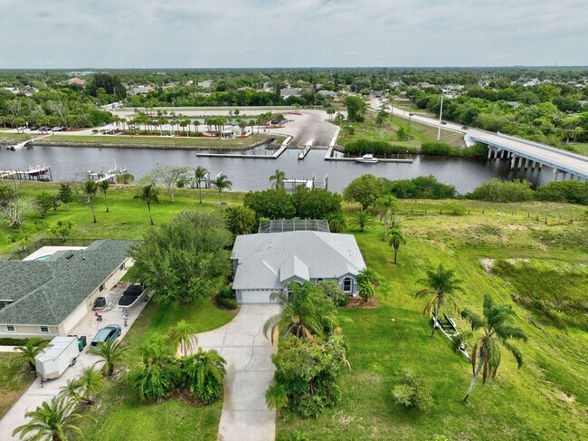 Building Photo - A BOATER'S PARADISE WITH THIS STUNNING 3 BEDROOM, 2 BATH WATERFRONT POOL HOME W/DOCK & BOAT LIFT ...