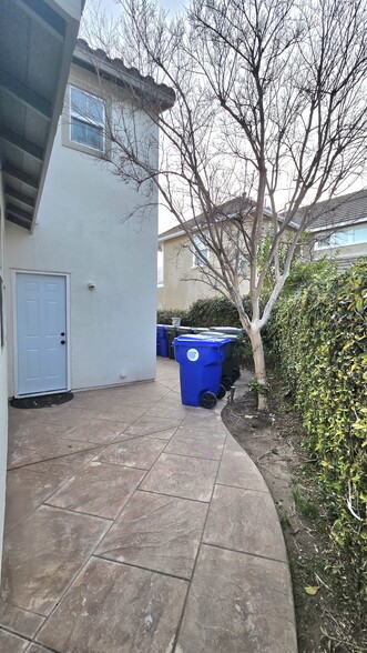 Side door that leads to the garage and plenty of additional backyard space - 24125 View Pointe Ln