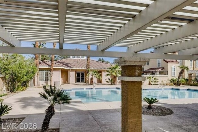 Building Photo - Bright Northwest Second-Floor Condo with Oversized Balcony & Community Pool!