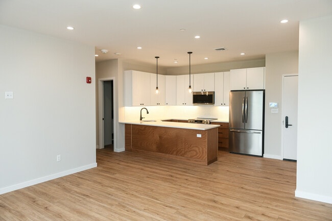 Living room into kitchen - 135 E Park Ave