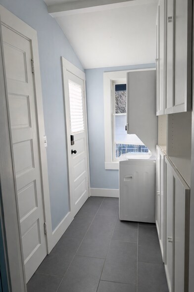 Spacious laundry area with build in cabinets for extra storage. - 604 NE Shaver St