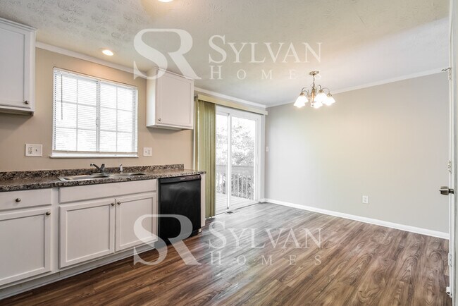 Building Photo - The living is easy in this 4 bedroom, 2 ba...