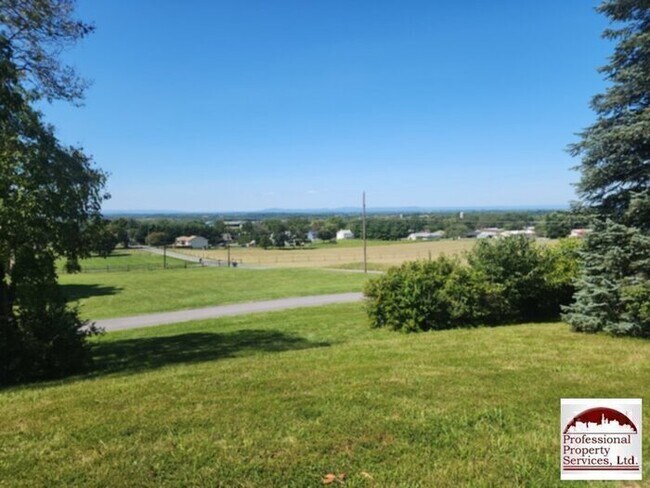 Building Photo - Charming Brick Rancher Offers A Perfect Blend Of Country Living And Convenience