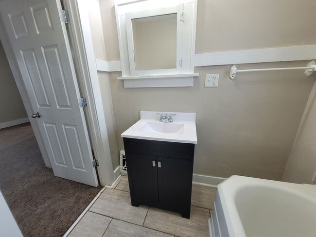 Building Photo - Four bedroom home on Indianola Ave with large yard and two decks!