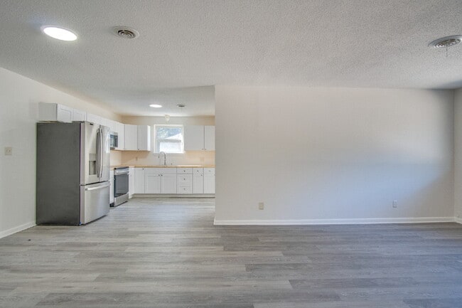 Building Photo - Stunning 4BR/2BA Pensacola Home with Private Pool, Modern Kitchen, Luxury Vinyl Flooring, Fully F...