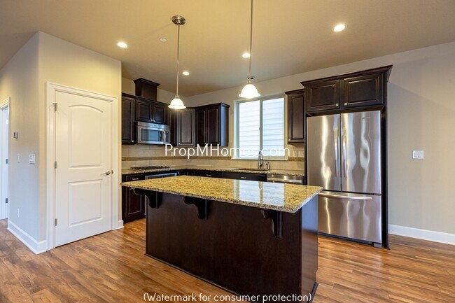 Building Photo - Beautiful Open Concept Four Bedroom Plus Office/Den in Villebois!