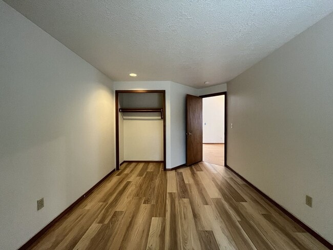 Building Photo - Spacious 3-Bedroom Home with Custom Stone Fireplace, Attached 2-Car Garage & Expansive Backyard i...