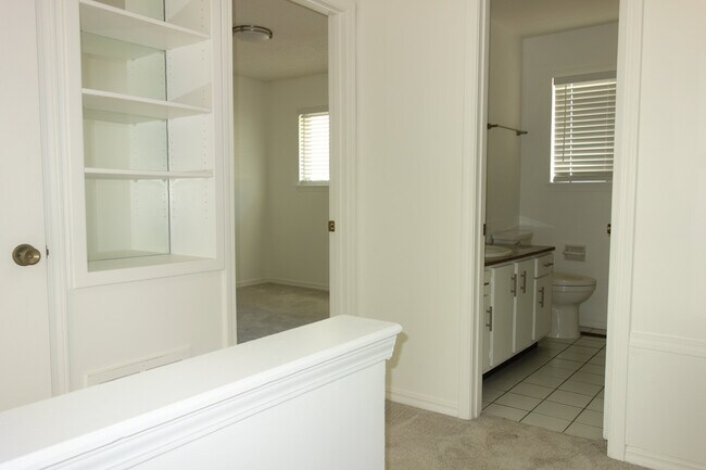 Upstairs landing with built-in shelves on left - 3421 E 35th St