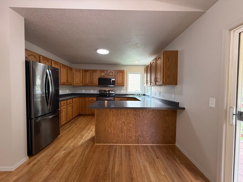 Kitchen with LG refrigerator - 2005 S Gordon Dr
