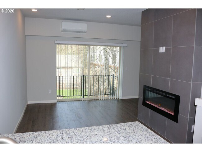 Building Photo - Modern 3-Bedroom Townhome-Style Home with Attached Garage, Private Patio & En-Suite Bathrooms in ...