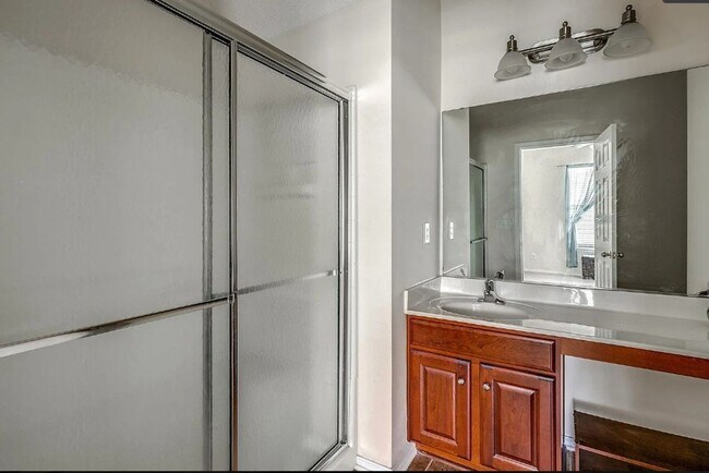 Building Photo - Relax and Unwind in this Spacious End-Unit...