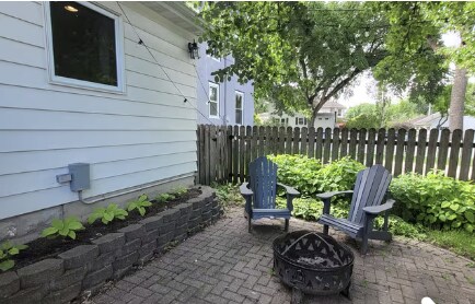 Backyard patio with firepit and chairs - 1121 6th St S