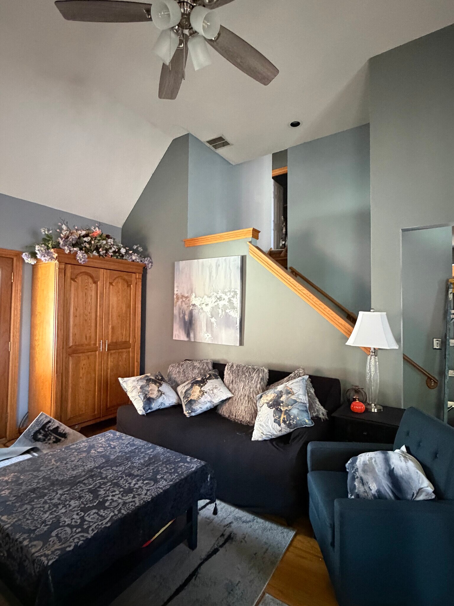 Living room with stairs to upstairs bed rooms with shared bath. - 20 Magnolia Hl