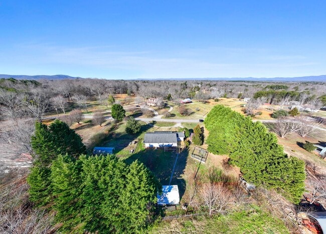 Building Photo - Welcome to this Comfortable, Charming & Outdoor Living, Single-Level Home