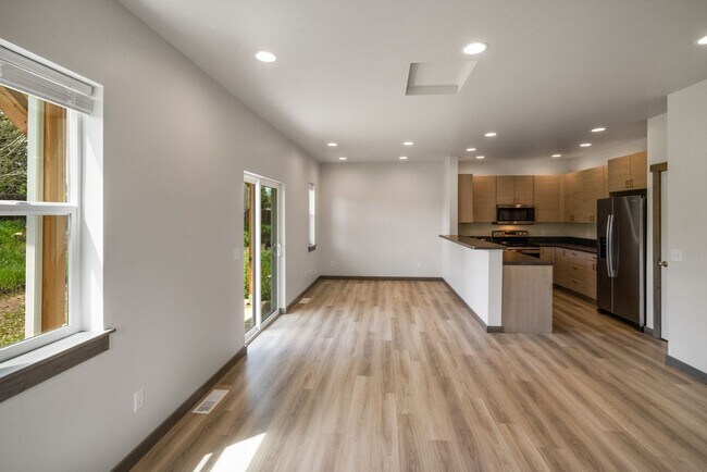 Building Photo - Pet Friendly! Gorgeous 3 Bedroom condo with double stall attached garages with AC.