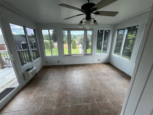 Building Photo - ***COMING SOON, JUNE 1ST*** 3 Bedroom 2 Bath house with attached garage, sun room, large back deck