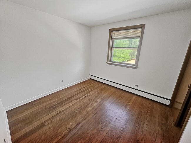 Building Photo - Mid-Century Modern 1-Bed + Den with Exposed Brick