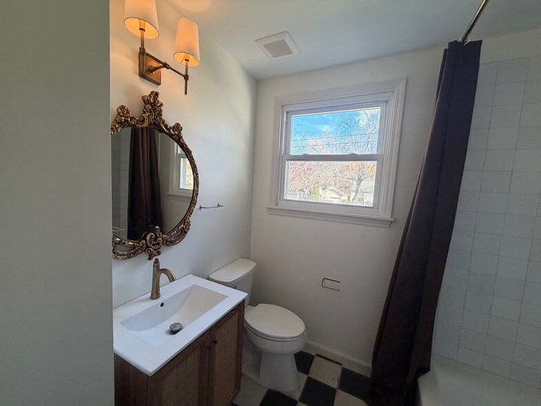 Renovated bathroom. - 5623 Meadowcrest Ln