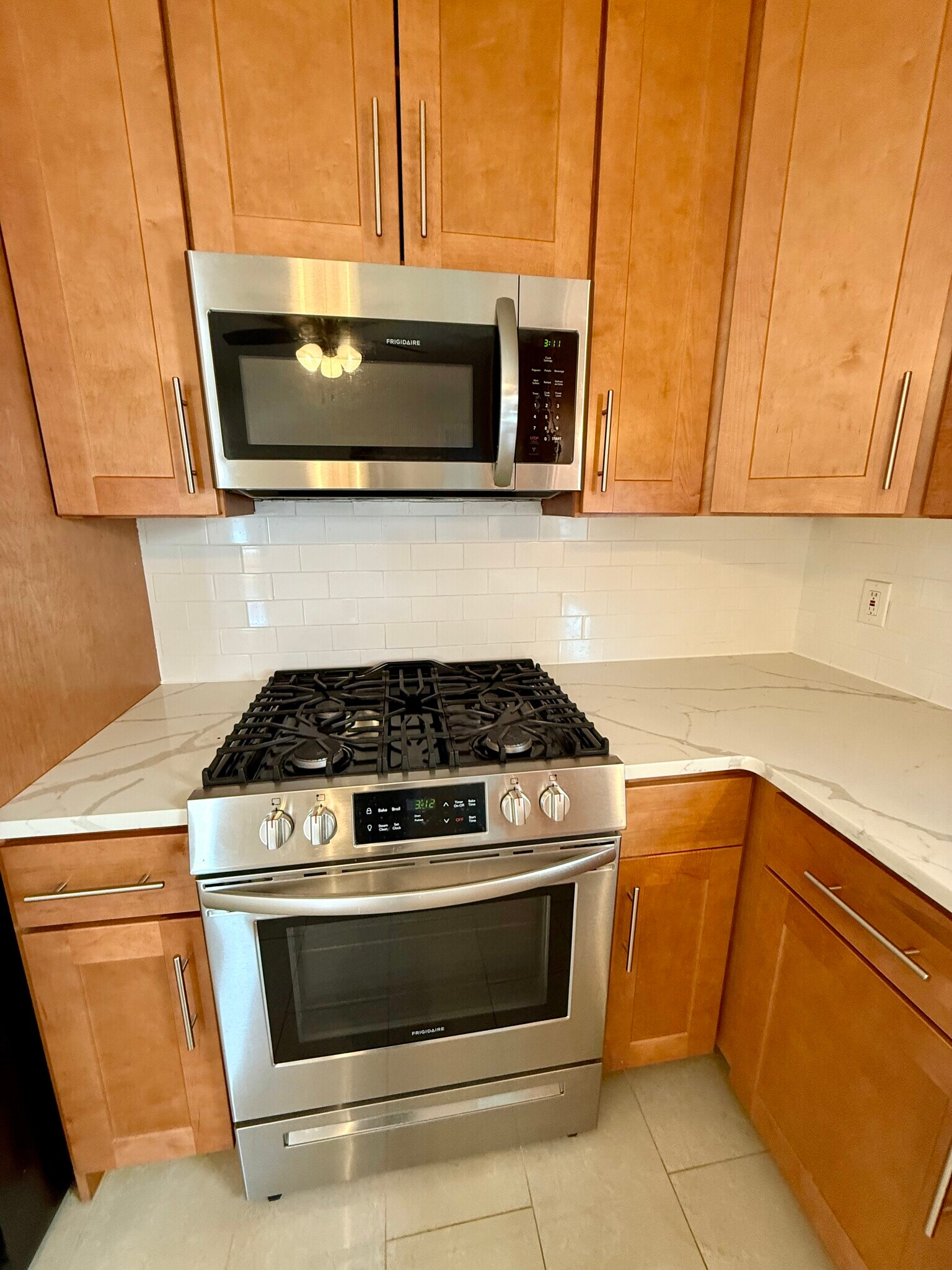 Updated kitchen with quartz counters and stainless steel appliances - 60 Baltimore Ave