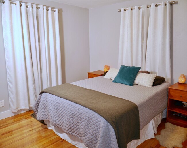 Bedroom with room-darkening curtains - 218 E Walton Ave