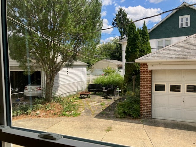 1/2 of garage behind house with parking plus a sandstone patio - 17003 Hilliard Rd