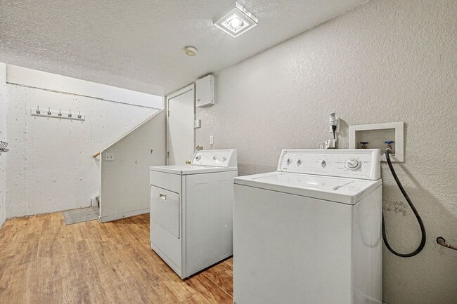 Building Photo - Beautiful 2BR Townhome in Gated Community with 2-Car Garage