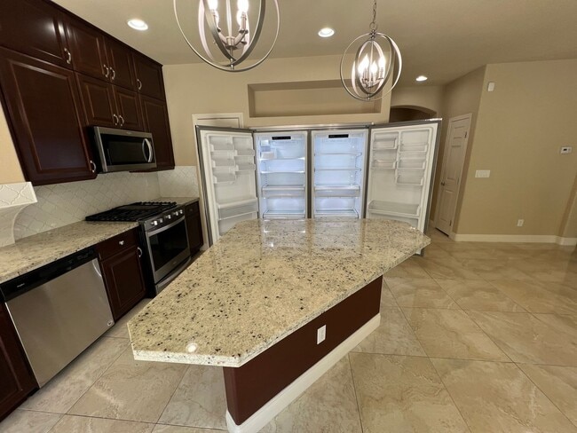 Building Photo - A Fantastic 4 Bedroom Home with the primary Downstairs, in Silverado Ranch