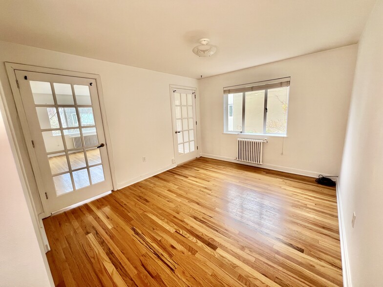 Main bedroom. Radiators in every room. Fitted for window AC unit. - 1800 Taylor Ave N