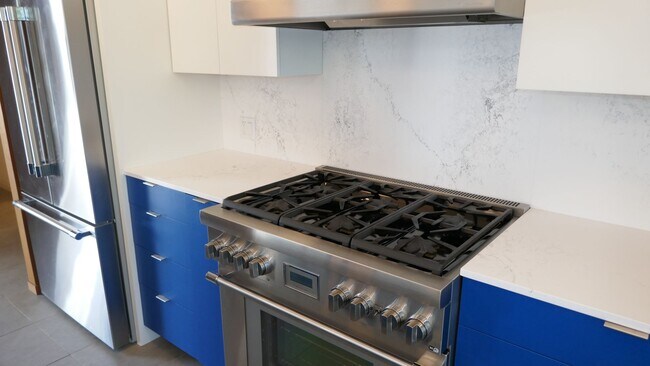 Building Photo - BEAUTIFUL UPDATED FOUR BED / TWO BATH PLUS OFFICE EICHLER HOME WITH GREAT OUTDOOR SPACE