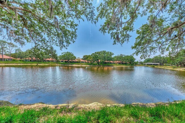 Building Photo - BEAUTIFUL 2 BEDROOM 2 BATHROOM + A DEN VILLA WITH GORGEOUS LAKE VIEWS!