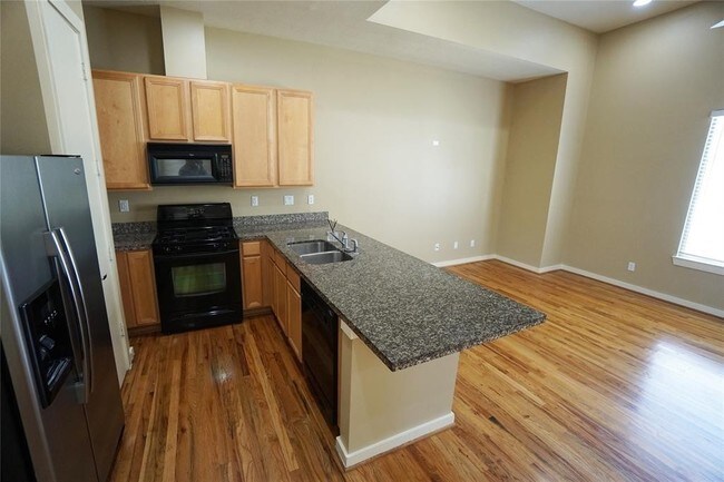 Building Photo - Elegant Gated Townhome Offering Unparallel...