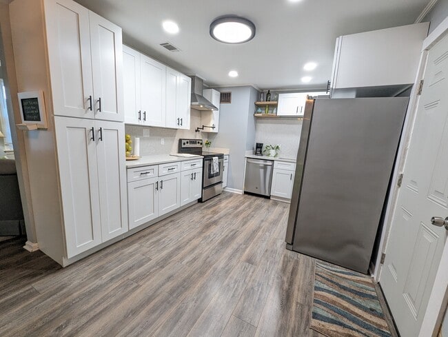 Updated kitchen with dishwasher and stainless appliances. - 4107 Crane St