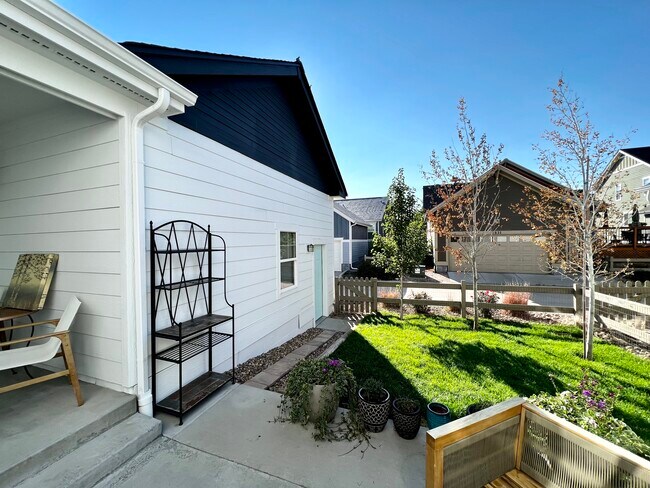 Back yard grass with Sprinkler, 2 aspens are removed - 2822 Cascade Creek Dr