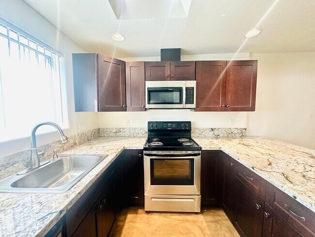 Building Photo - Holiday Move In Special! 1/2 Off December's Rent! Unique Townhome with Open Layout! All Appliance...