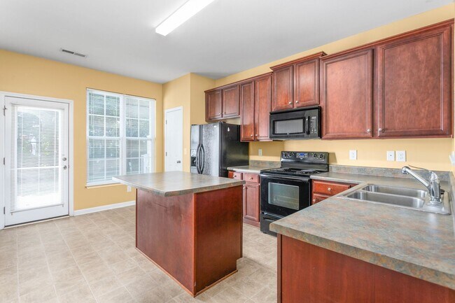 Building Photo - **Charming 2/2.5 Burlington Townhome**
