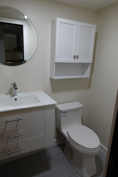 Newly renovated powder room on the first floor is convenient and spacious! - 327 Hudson Ave