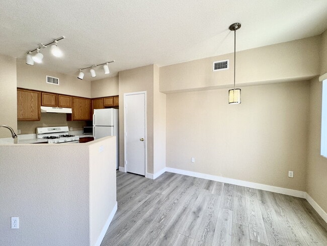 Building Photo - DOWNSTAIRS CONDO | GATED COMMUNITY | CENTENNIAL HILLS | UPDATED 3 BEDROOM