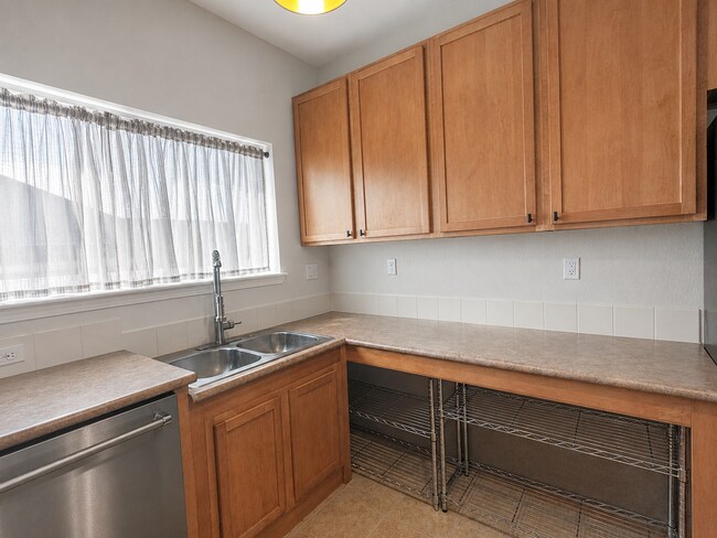 Building Photo - Spacious 2-Bedroom Condo with Garage, Fireplace, Pool & Most Included Utilities