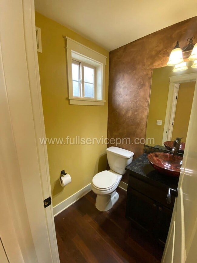 Building Photo - Spacious townhome with private backyard, garage parking, multiple decks, and a dedicated home off...
