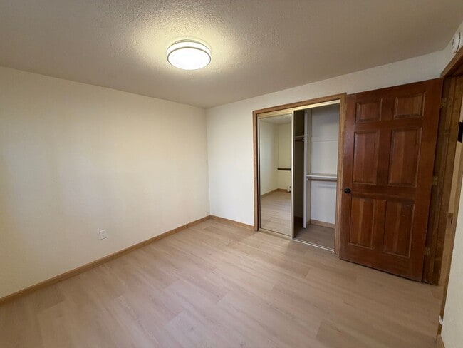 Building Photo - Tri-Level Lake Village Condo with Upgrades