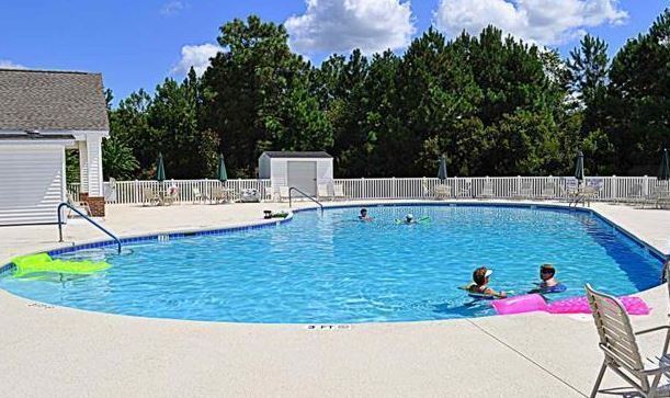 Building Photo - Like New 3 Bedroom & 2 Bath pond front home in Hillsborough! Enjoy the Community Pool, Playground...