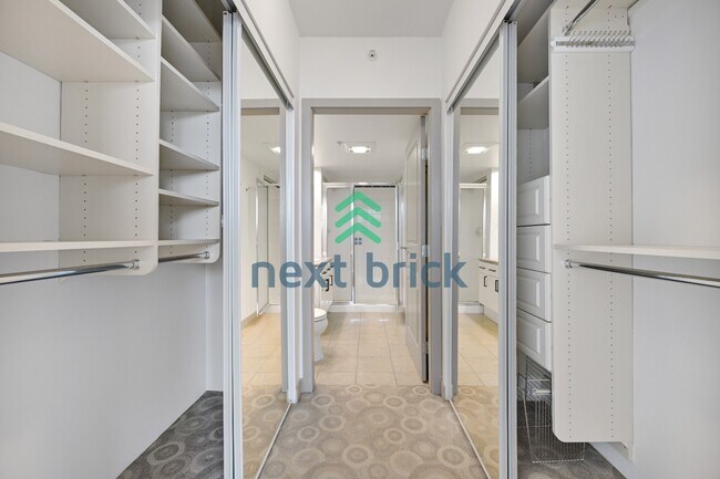 Building Photo - Stunning 2-Bed Corner Condo with Water and Mountain Views