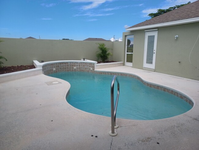 Building Photo - Unique Courtyard home 3/3 with pool