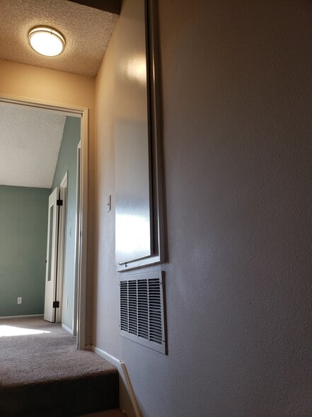 2nd floor landing looking into Primary Bedroom - 1360 Alessandro Dr