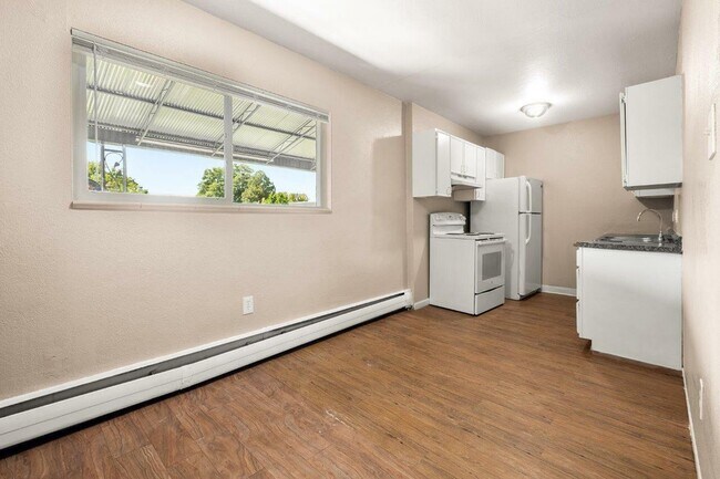 Step into this bright and spacious kitchen, perfect for culinary adventures. - 1690 EATON
