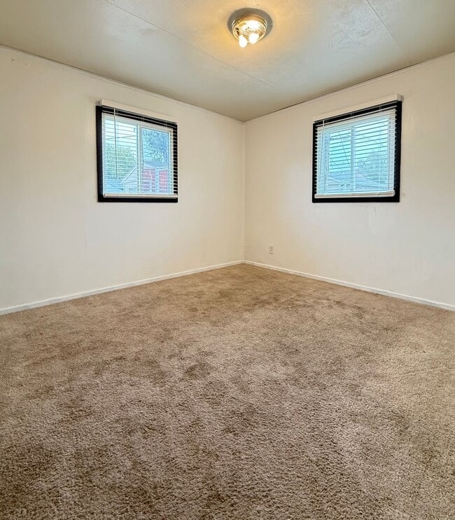 Building Photo - Cozy Main-Floor Living with Garage & Yard